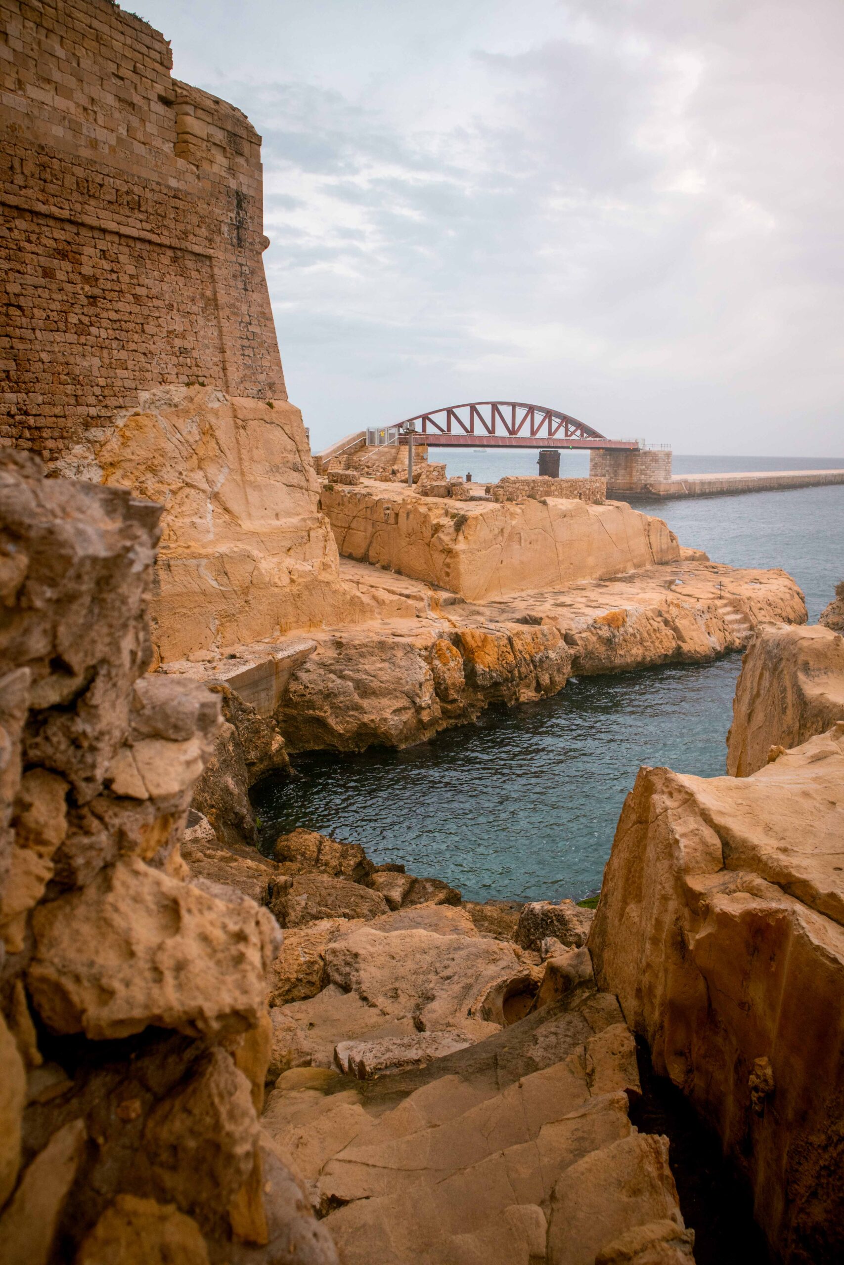 Coastal walk near Saint Elmo Bridge in Valletta, Malta