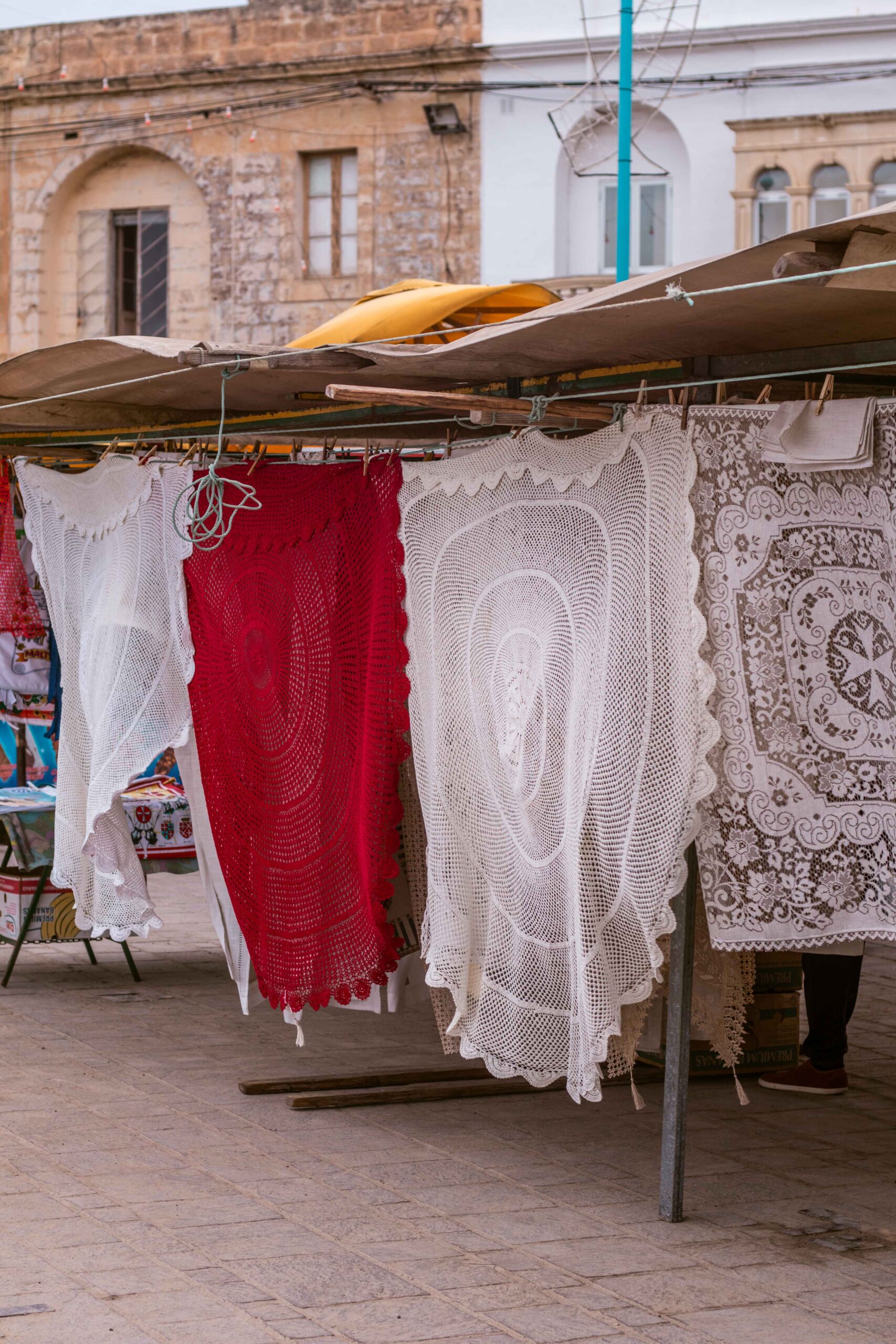 Handcraft tablecloths, cloths, blankets and lace in Marsaxlokk market, Malta