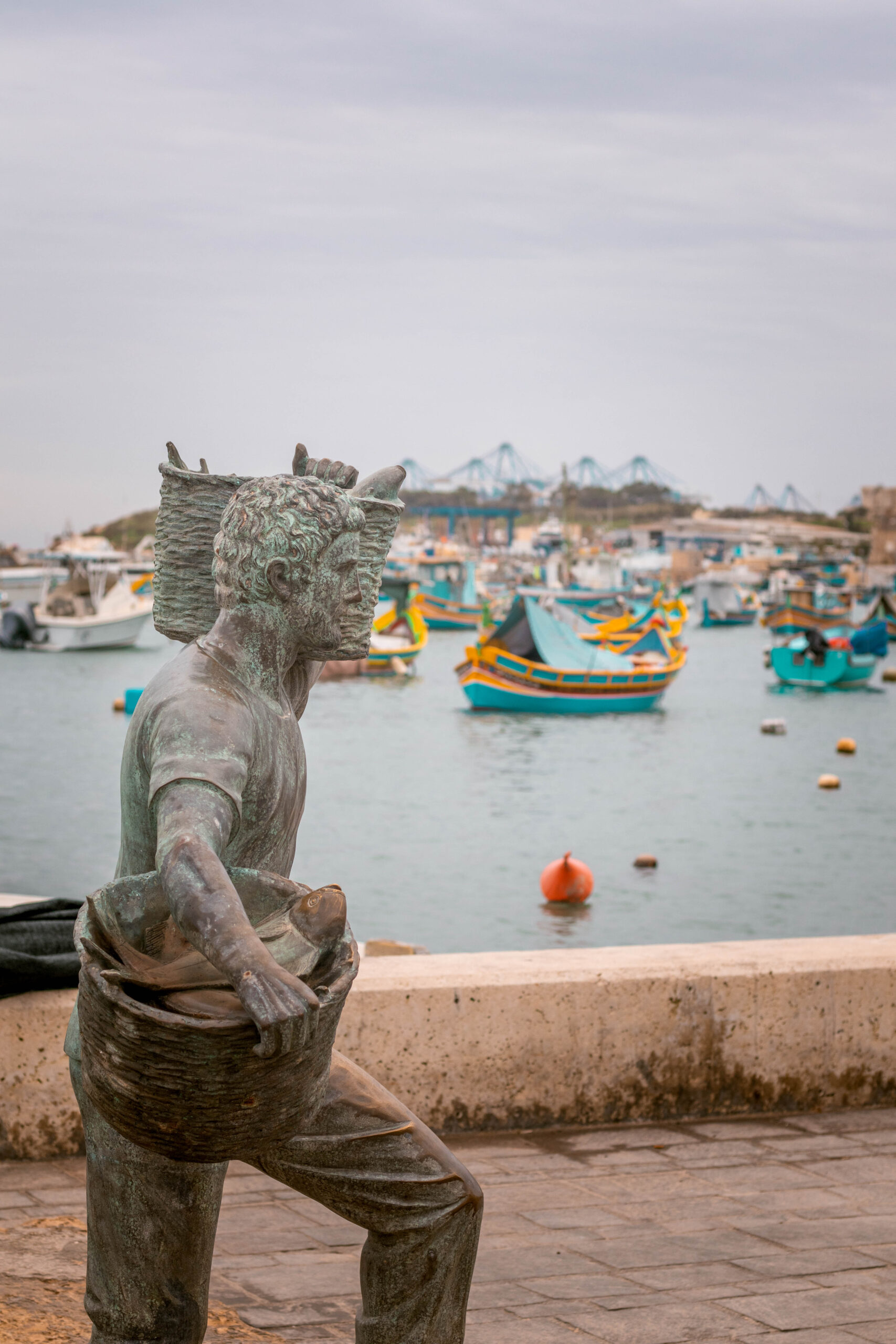 Statue of a fisherman in Marsaxlokk market, Malta