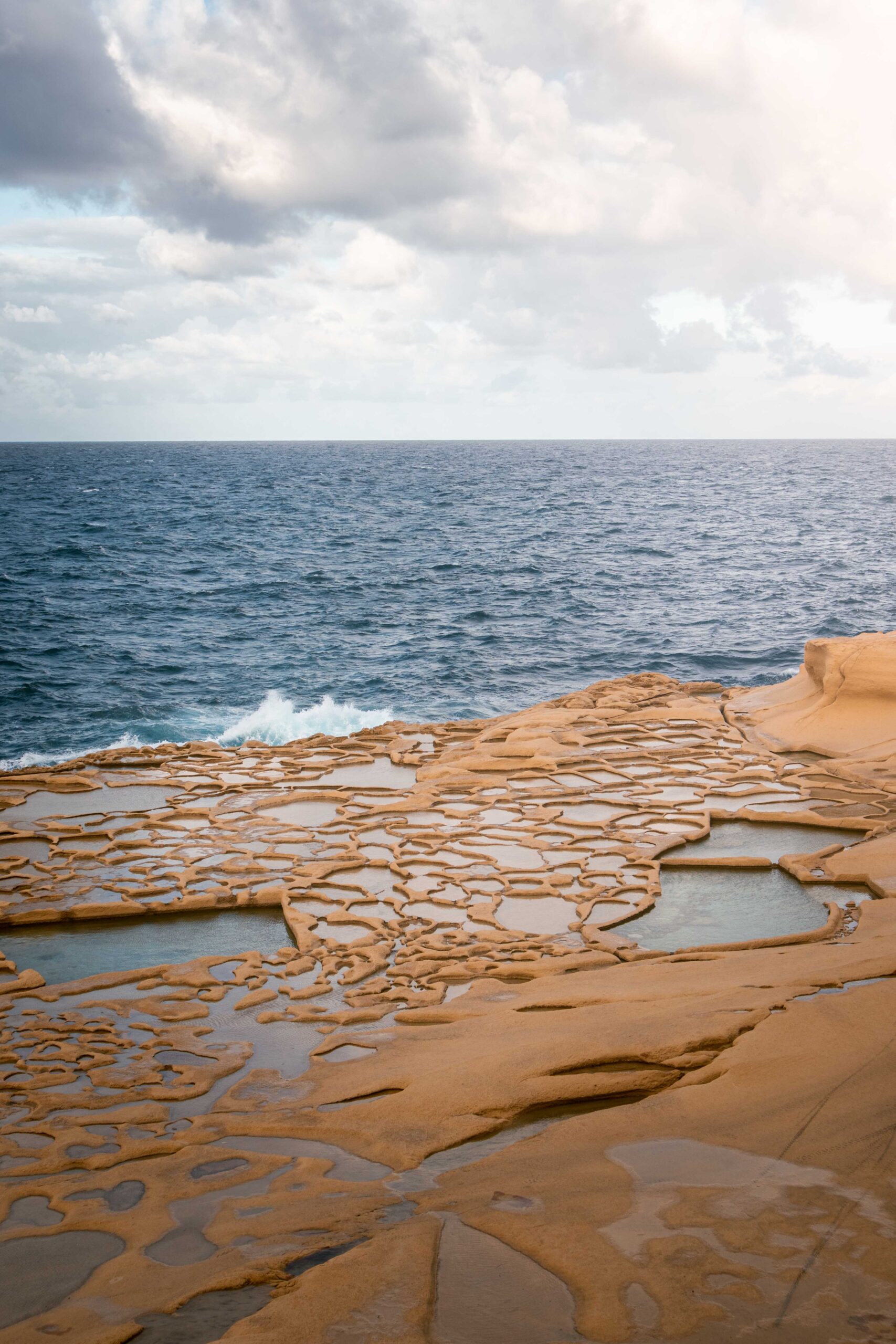 Agitated sea at Xwejni Salt Pans in Gozo island, Malta