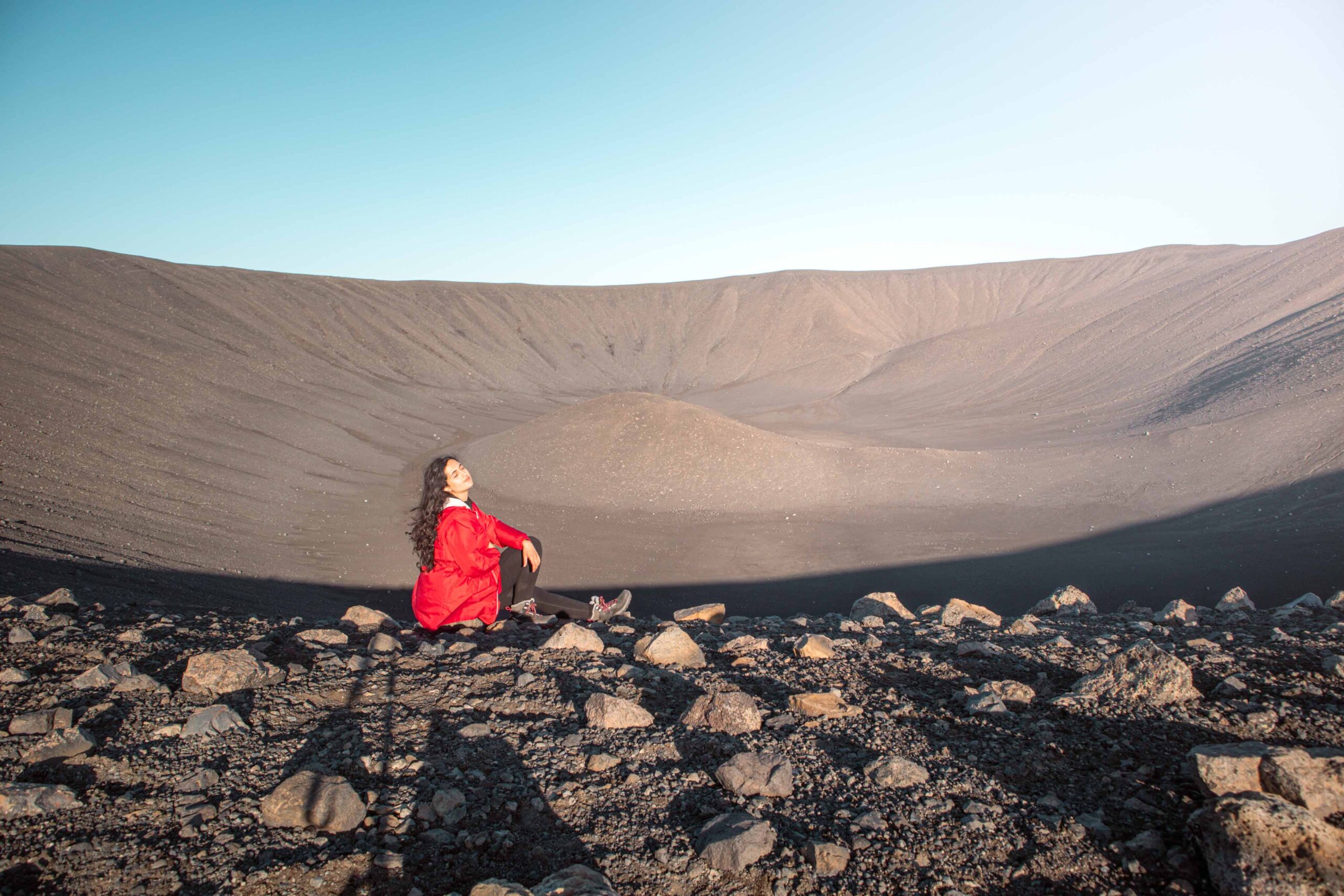 Woman posing on the rim of Hverfjall crater in Lake Mývatn area, North Iceland