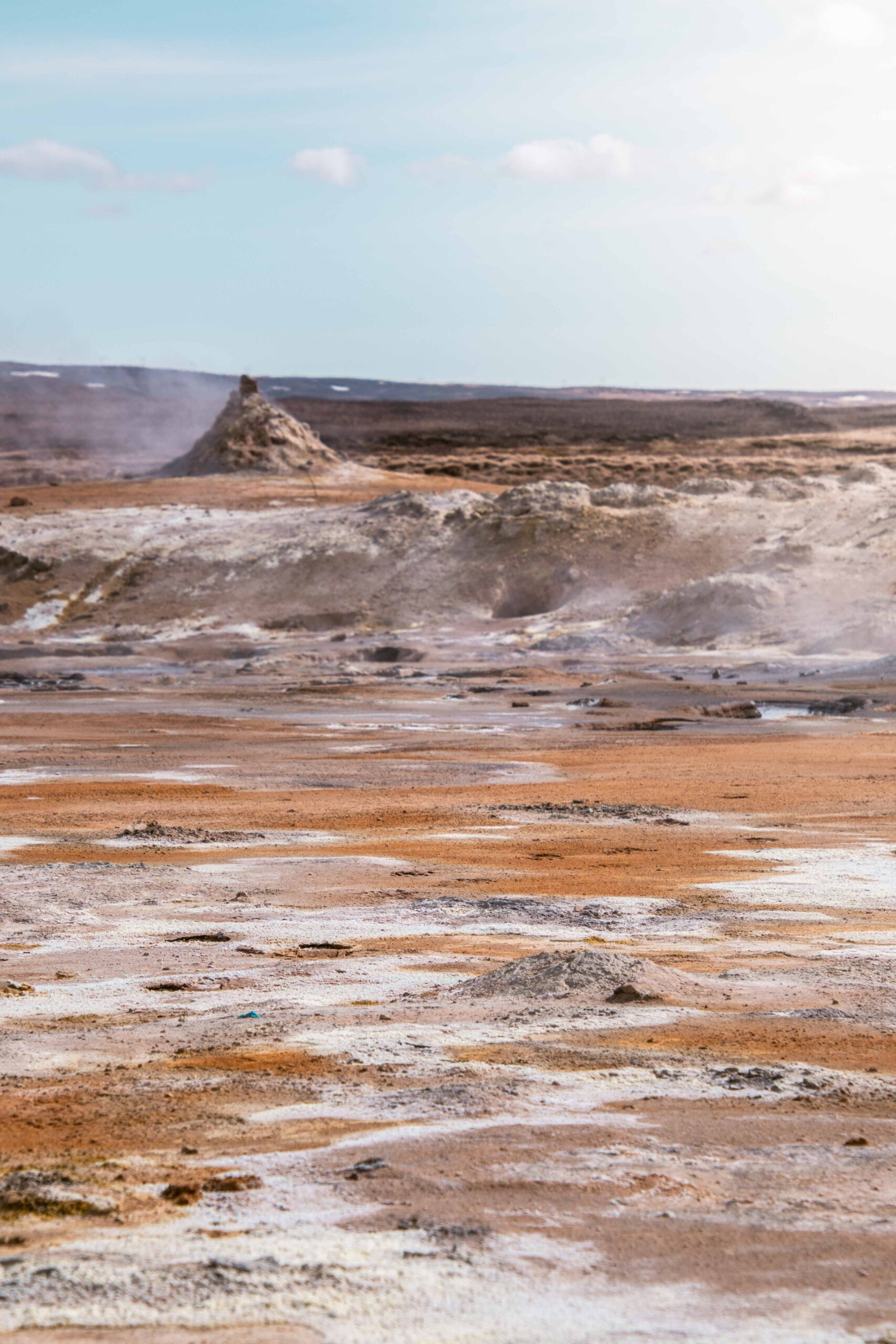 Hot sulphur ground in Hverir (Hverarönd) geothermal area and steaming fumarole near Lake Mývatn, North Iceland