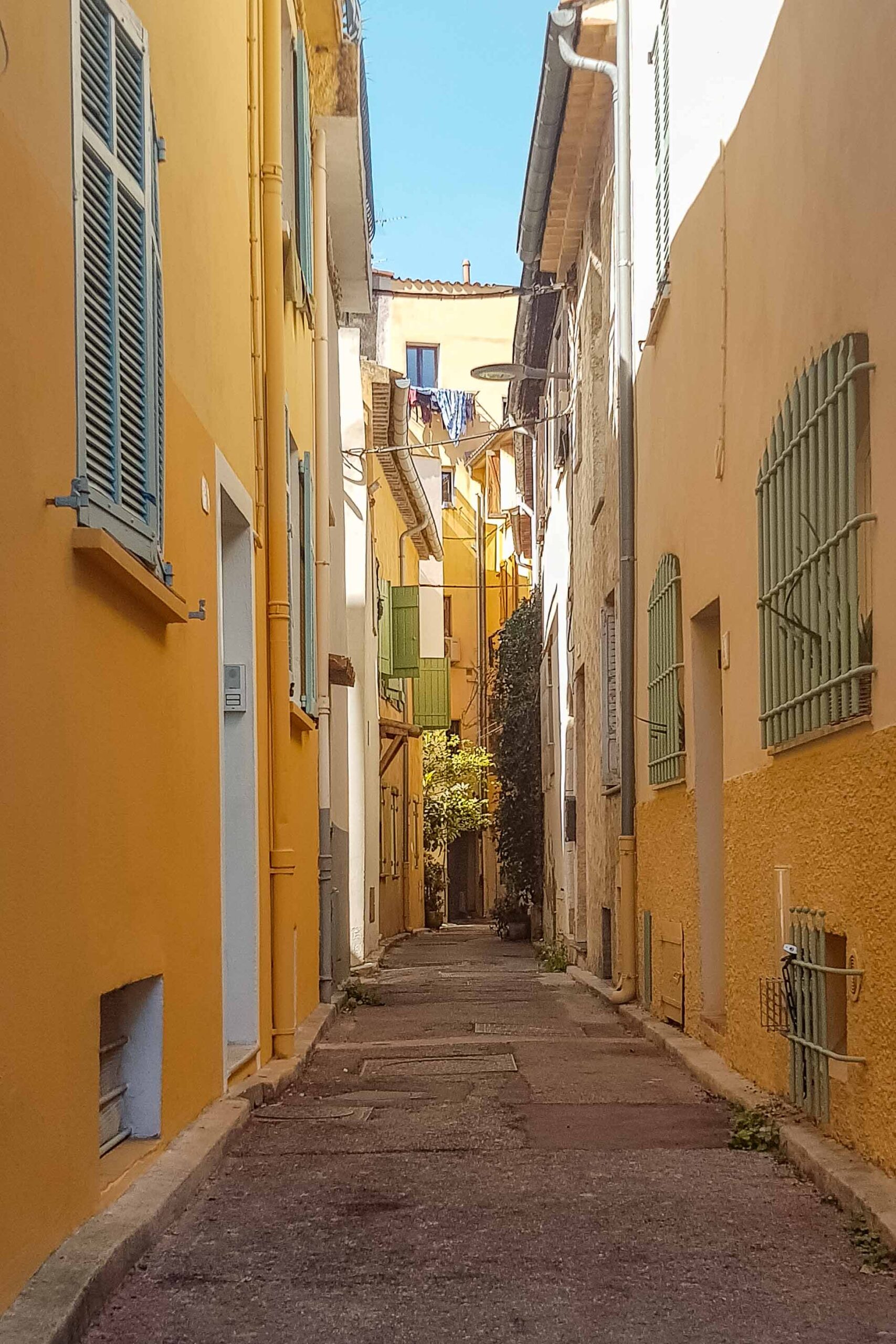 Small colourful street in the Old Town of Antibes, France