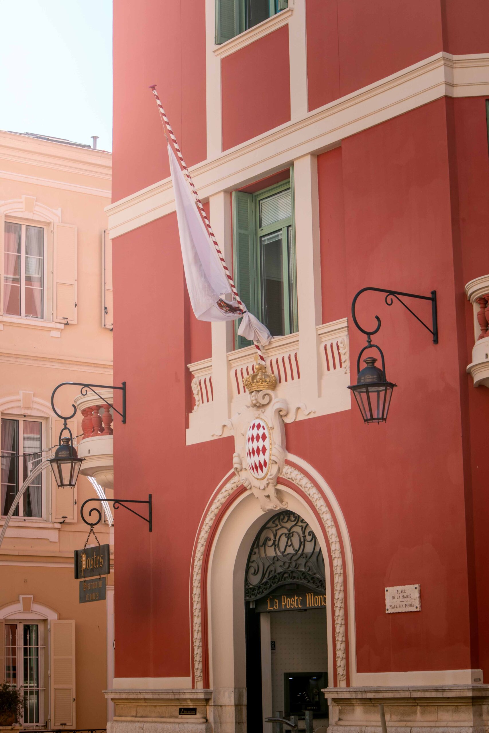 Details of the red facade building of the post office in the Old Town of Monaco, located on The Rock ("Le Rocher") in Monaco