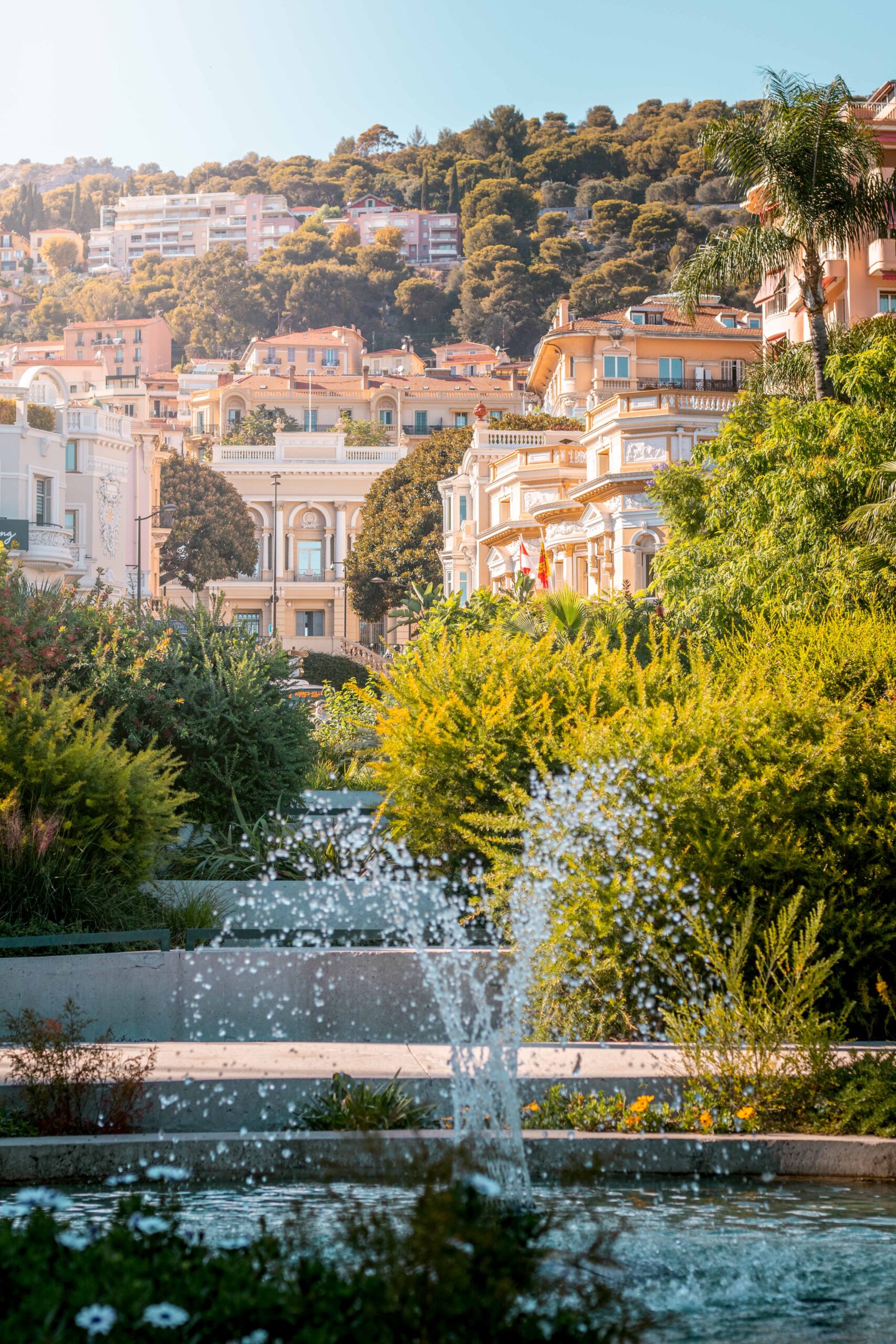 Fountains and terraced gardens from the Casino Garden during a sunny day in Monaco