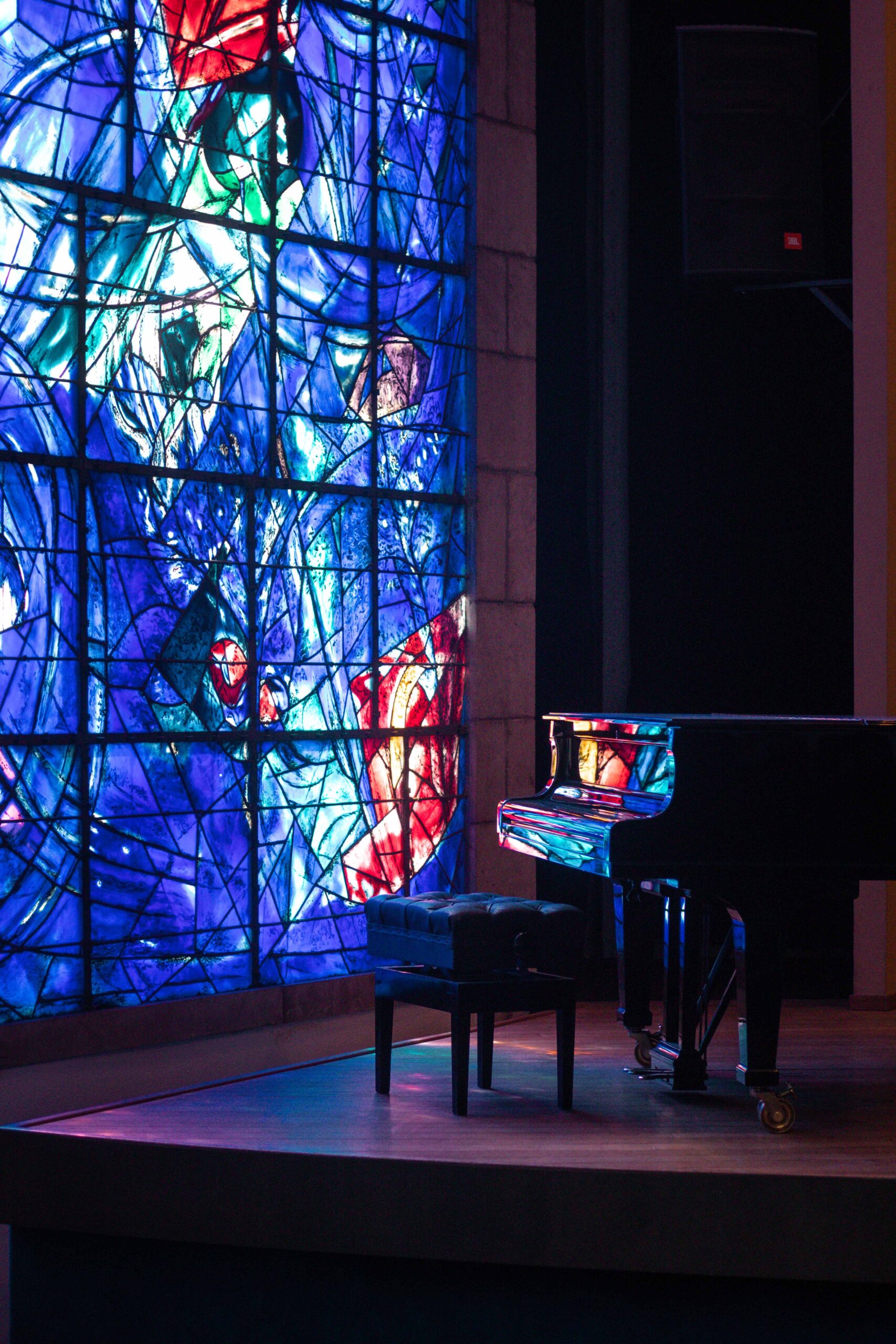 Piano and stained glass inside the chapel of the Marc Chagall National Museum (Musée National Marc Chagall) in Nice, France