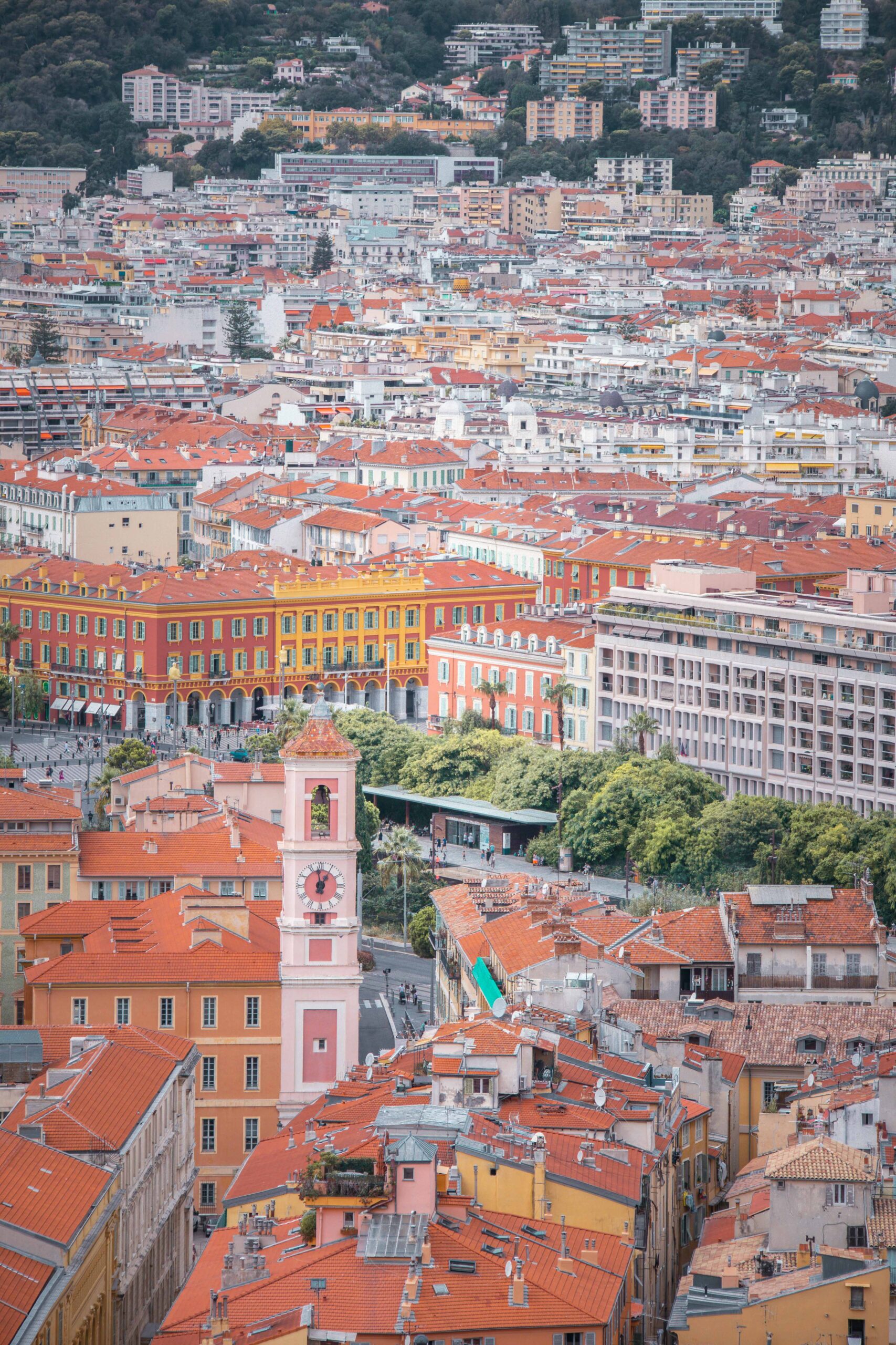 Panoramic view of the rooftops and Place Masséna as seen from the Colline du Château (Castle Hill) park in Nice, France