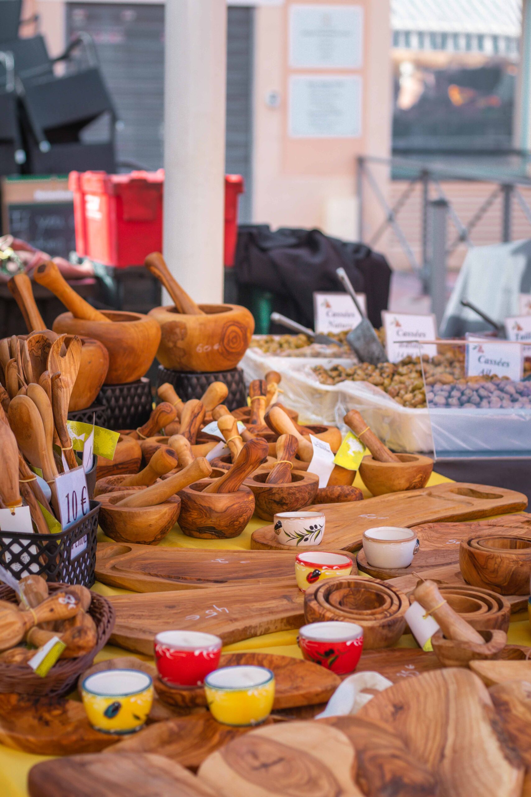 Details of a market stall selling wooden crafted cooking tools at the Marché Aux Fleurs Cours Saleya in Nice, France