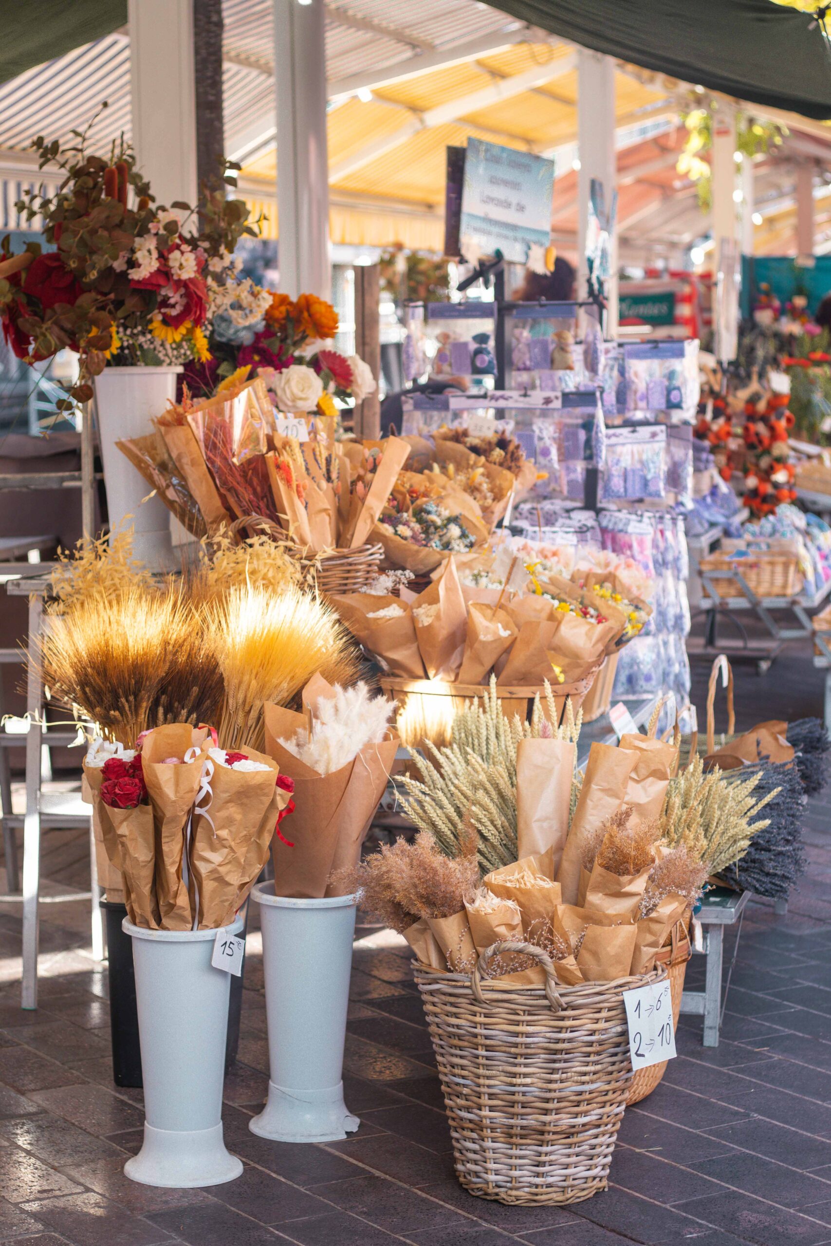Details of a market stall selling flowers and dried bouquets at the Marché Aux Fleurs Cours Saleya in Nice, France