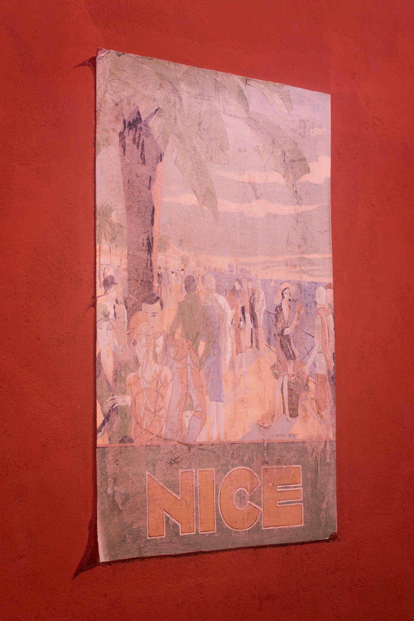 Vintage poster on a red wall in the Old Town of Nice (Vieux-Nice) in Nice, France