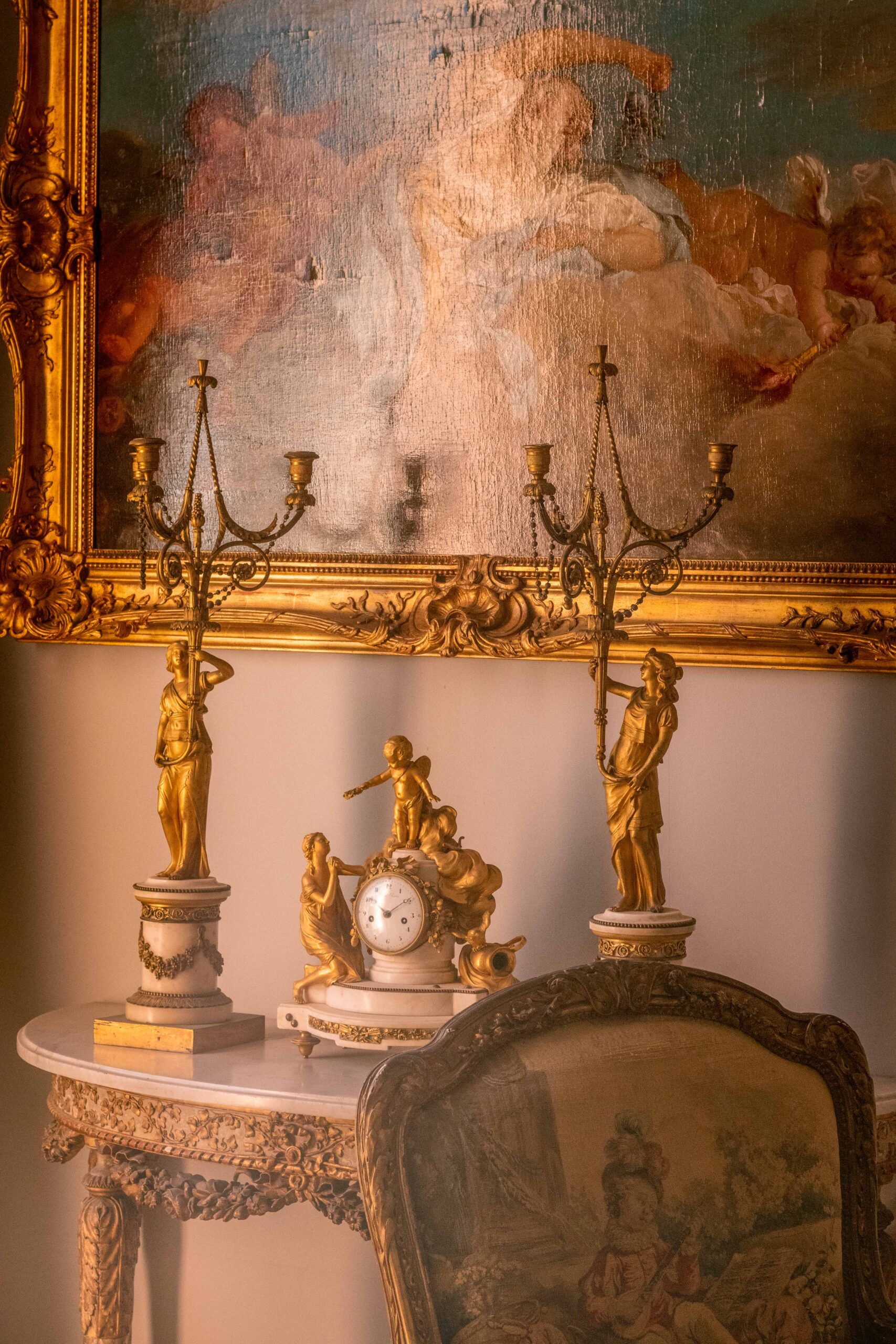 Details (clock, golden figurines, painting, chair) indoor the Villa Ephrussi de Rothschild in Saint-Jean-Cap-Ferrat, France