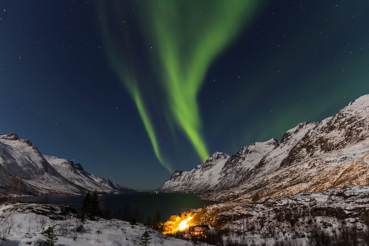 Brown mountain hills at green sky during night time in Ersfjorden, Norway. Original public domain image from Wikimedia Commons